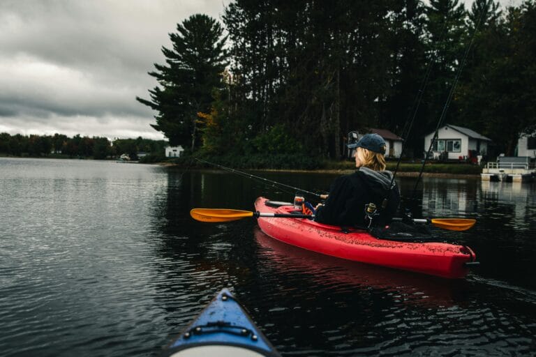 a girl fishing on a fishing kayak