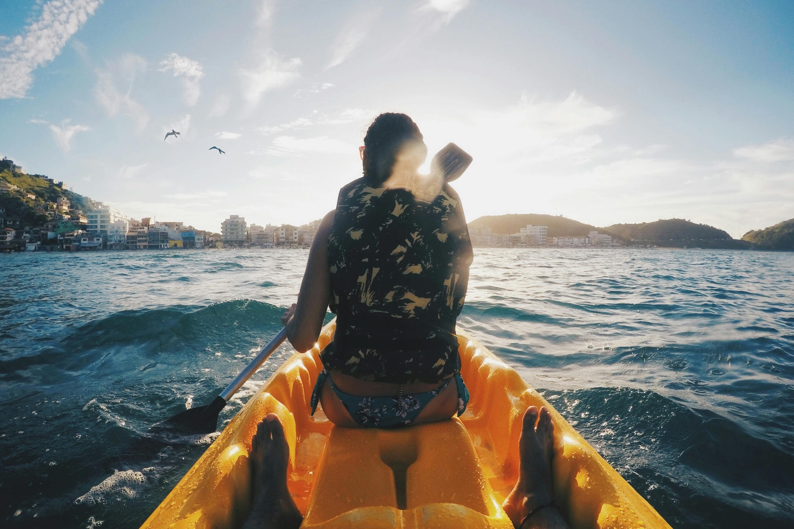 a girl enjoying the river view from a kayak